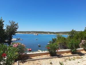 a view of a lake with boats in the water at Apartments Nikola Caska in Novalja
