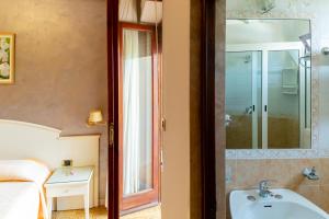 Koupelna v ubytování Hotel Riviera