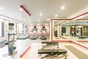 a gym with a row of treadmills and machines at Crowne Plaza Hotel Harrisburg-Hershey, an IHG Hotel in Harrisburg