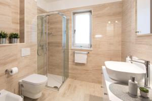 a bathroom with a toilet sink and a shower at Villa Diamond - Muraj Krk in Kornić +46 photos