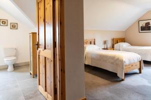 Voodi või voodid majutusasutuse Twin Peaks B&B toas