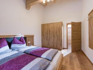 Postel nebo postele na pokoji v ubytování Bergappartements Reithammer - Ellmau