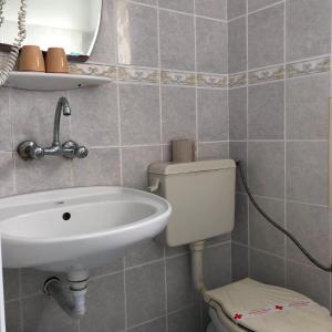 A bathroom at Sunny Varshava Hotel