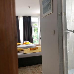 A bed or beds in a room at Sunny Varshava Hotel