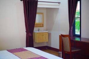 Postel nebo postele na pokoji v ubytování Punyin Hotel Inthanon -ปั้นหยิ่น โฮเทล