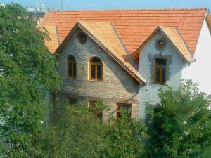 a large house with an orange roof at Hungaria Guesthouse in Budapest