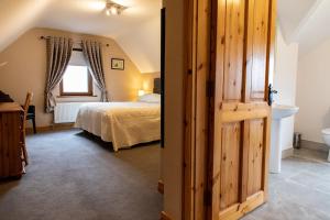 Voodi või voodid majutusasutuse Twin Peaks B&B toas