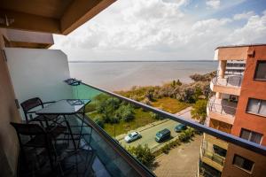 a balcony with a view of the water at Moonlight Apartments in Mamaia