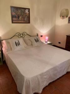 Posteľ alebo postele v izbe v ubytovaní Casa del Capitano Rocca d'Orcia
