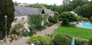 an aerial view of a house with a garden at Hôtel-Restaurant Ricordeau in Loué