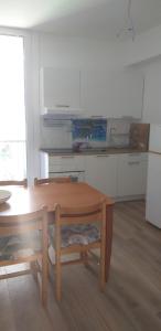 a kitchen with a wooden table and a table and a table and a table at Rocce sul Mare in Deiva Marina