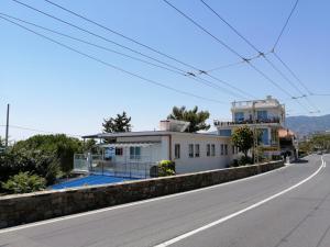 a house on the side of a road at Villaggio Turistico LA VESCA in Sanremo