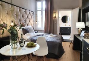 Posteľ alebo postele v izbe v ubytovaní DK Premium Śródmieście