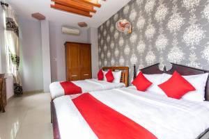 Postel nebo postele na pokoji v ubytování Honey Hotel Da Nang