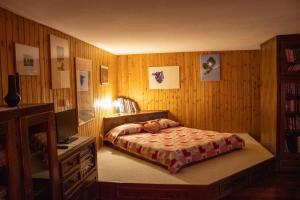 Postel nebo postele na pokoji v ubytování Appartamenti Maison Guyon