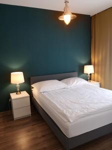 Кровать или кровати в номере Apartamenty Lawendowy Zakątek 4