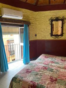 a bedroom with a bed and a window at PENSION VERGARA , Sevilla in Seville
