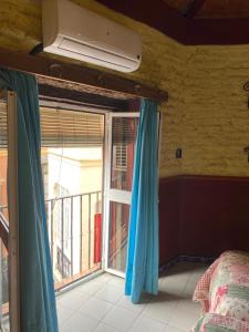 a room with a bed and a window in it at PENSION VERGARA , Sevilla in Seville