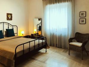 Postel nebo postele na pokoji v ubytování Rifugio a Mottola