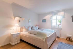 Ein Bett oder Betten in einem Zimmer der Unterkunft Belle Maison - Das kleine Hotel