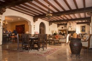 a dining room with a table and chairs at The Holland Hotel in Alpine
