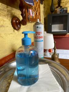 a bottle of water sitting on top of a sink at PENSION VERGARA , Sevilla in Seville