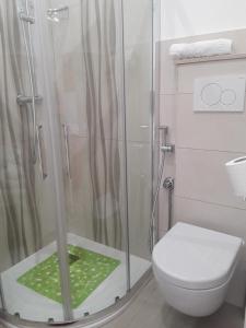 a bathroom with a shower and a toilet at Casa Mina affittacamere in Polignano a Mare