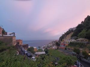 a town on a hill with the ocean in the background at Villa Celentano in Positano