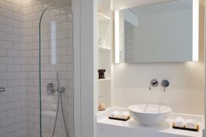 a bathroom with a sink and a shower at Vincci EverEden in Anavyssos