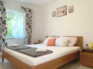 Posteľ alebo postele v izbe v ubytovaní Apartment GardenView - New!