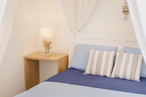 Le Volte Procida Home客房内的一张或多张床位