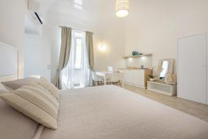 Le Volte Procida Home客房内的一张或多张床位