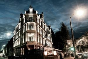 a large building on a city street with a street light at Kleiner Rosengarten in Mannheim