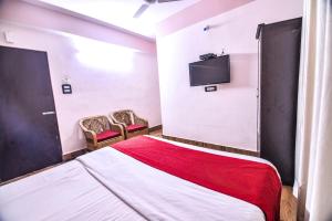 Tempat tidur dalam kamar di Hotel Aashiyana