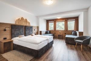 Ένα ή περισσότερα κρεβάτια σε δωμάτιο στο BergHotel Majarei