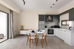 Kuchyň nebo kuchyňský kout v ubytování Armonia Suites