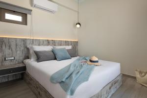 Postel nebo postele na pokoji v ubytování Armonia Suites