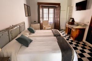 Posteľ alebo postele v izbe v ubytovaní La Alberca de Fariñas