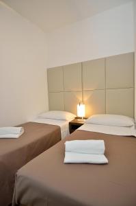 Postel nebo postele na pokoji v ubytování Hotel San Giuliano