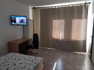 TV a/nebo společenská místnost v ubytování Casa Philos