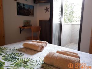 Postel nebo postele na pokoji v ubytování Elim Suite & Rooms + 37 fotografií