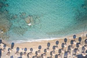 an overhead view of a beach with chairs and the ocean at Vincci EverEden in Anavyssos
