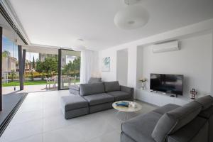 TV a/nebo společenská místnost v ubytování Ocean 11 Villa