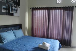 Postel nebo postele na pokoji v ubytování Ady Homestay