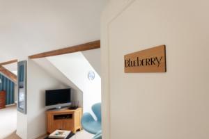 TV a/nebo společenská místnost v ubytování Boutique B&B The Townhouse