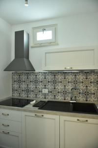 Una cocina o zona de cocina en Tobacco Suite