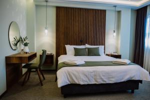 Ένα ή περισσότερα κρεβάτια σε δωμάτιο στο Hotel Kapri