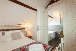 Postel nebo postele na pokoji v ubytování Boutique B&B The Townhouse