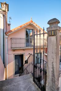 a house with a gate and a balcony at Sintra Bliss A Part in Sintra