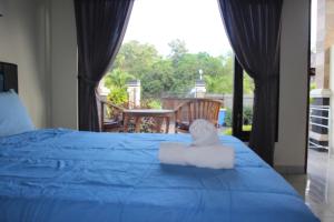 Postel nebo postele na pokoji v ubytování Ady Homestay